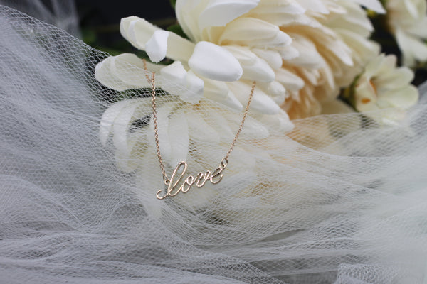 "love" cursive script necklace