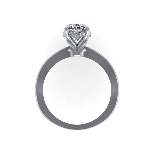 Hidden Halo with Tapered Shank Featuring Oval Brilliant This ring features an oval brilliant center stone set in a tapered pinched solitaire shank with a diamond basket that elegantly cradles the center stone.