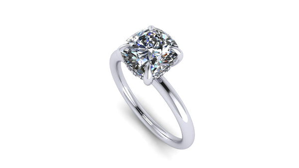 Cushion-Cut Center Stone with Diamond Hidden Halo Engagement Setting  This ring features a square cushion brilliant center stone set in an all-around comfort fit rounded solitaire shank with a diamond basket that elegantly cradles the center stone.